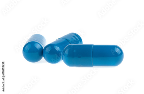 three blue capsule medicine isolated on white background