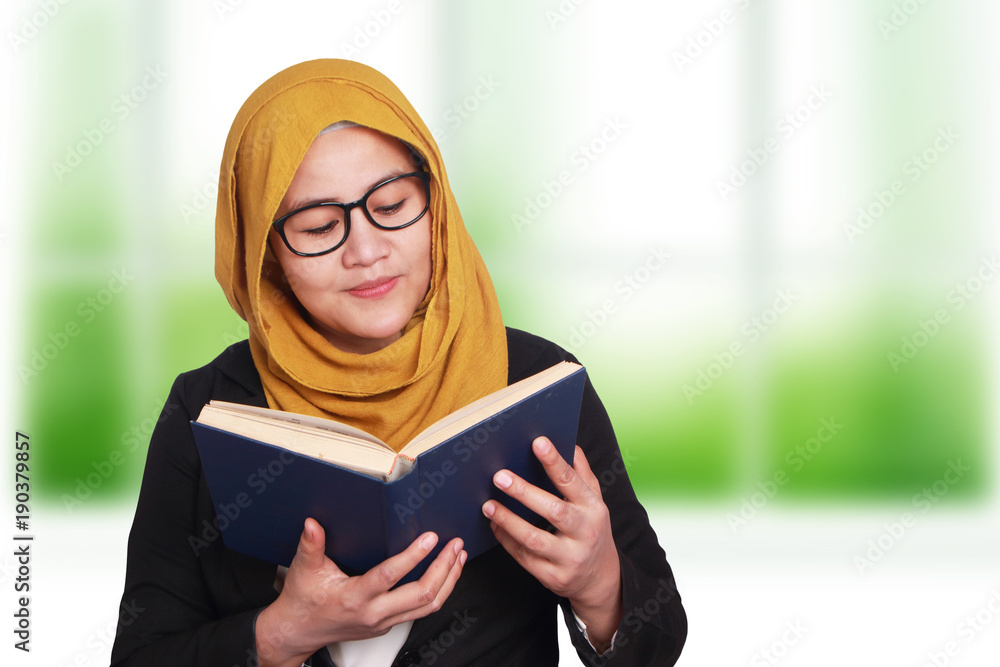 Muslim Businesswoman Reading Book Muslim Businesswoman Reading Book