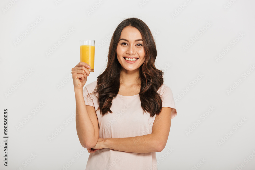 Portrait of a happy young asian woman holding glass Portrait of a happy young asian woman holding glass