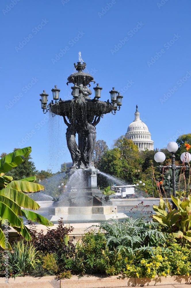 Fototapeta premium The fountain is a symbol of success and abundance./ The Bartholdi fountain is located near greenhouses of the Botanical garden. 