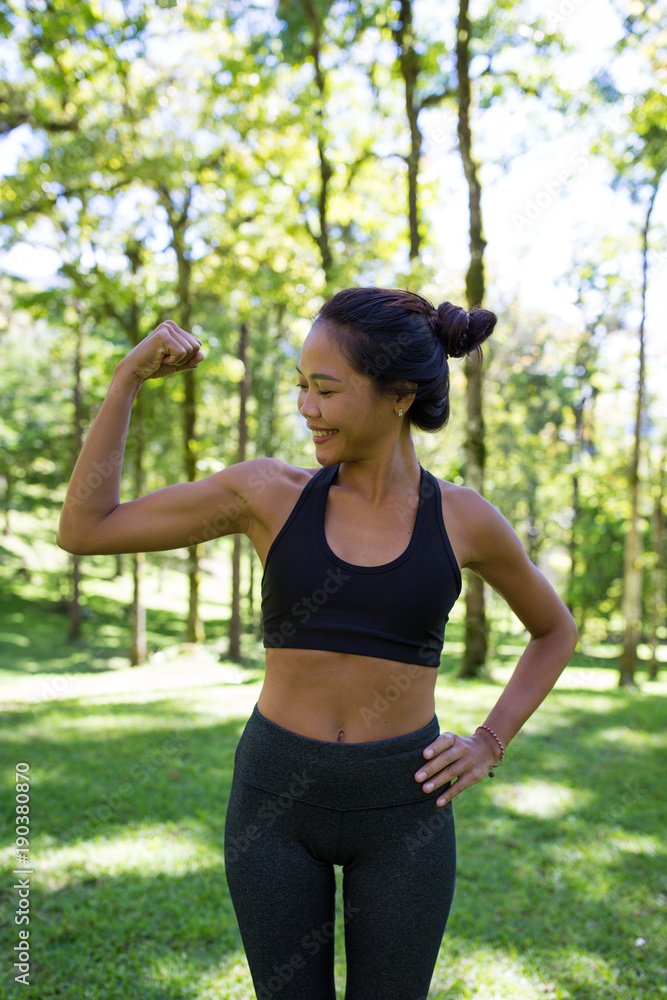 Young Asian girl practicing yoga outdoors. Young Asian girl practicing yoga outdoors.