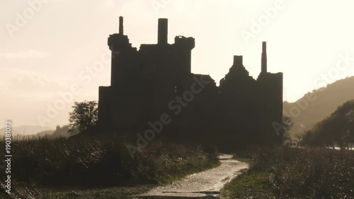 Ancient Castle on a lake in Scotland after the rain