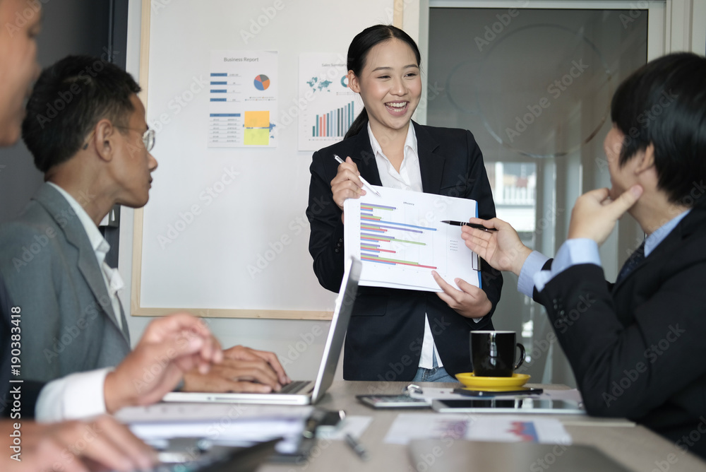 businesswoman present financial plan report to co worker team. woman leader discuss sales data with investor colleagues. finance investment business meeting businesswoman present financial plan report to co worker team. woman leader discuss sales data with investor colleagues. finance investment business meeting