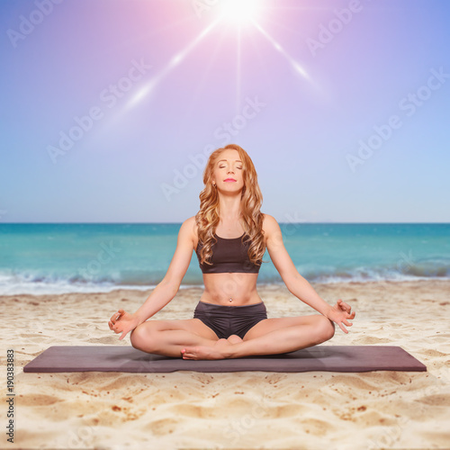 yoga at sunset on beach photo