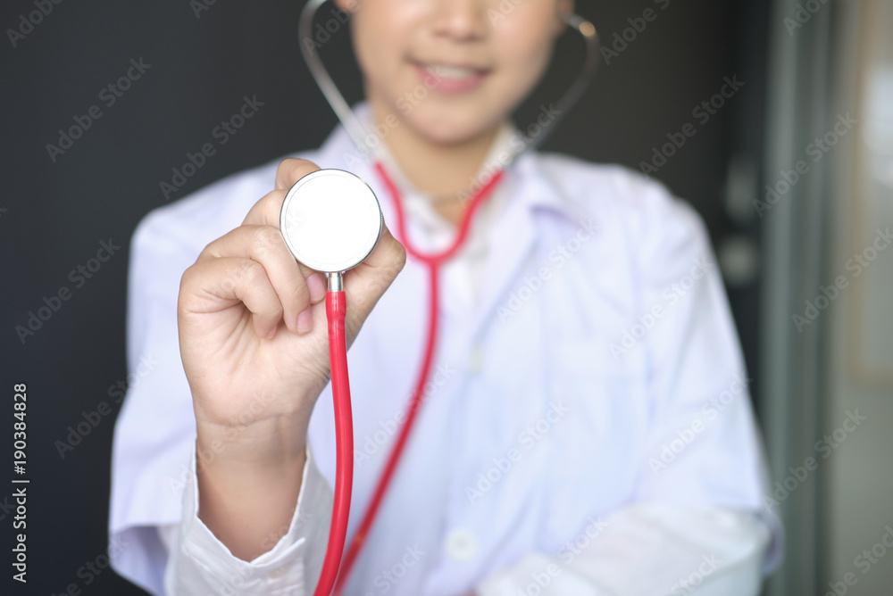 female doctor showing stethoscope for checkup at clinic. physician or medical practitioner holding stethoscope to auscultate breath in medical visit female doctor showing stethoscope for checkup at clinic. physician or medical practitioner holding stethoscope to auscultate breath in medical visit
