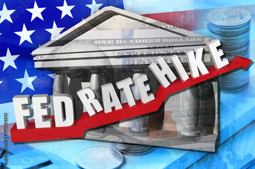 Text " FED RATE HIKE"on red arrow overlay with dollar banknote with background U.S.flag.