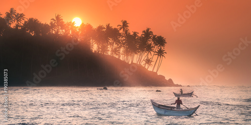 Vászonkép Tropical beach on sunset with palm and sea