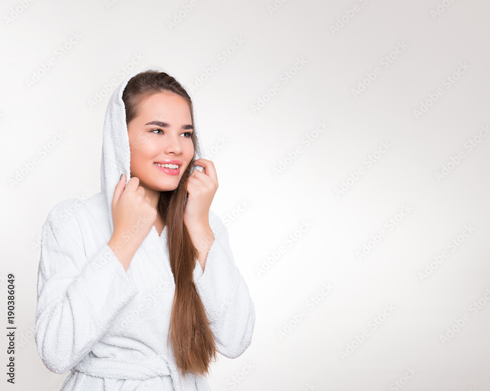 beautiful young woman with long hair wearing a bath robe beautiful young woman with long hair wearing a bath robe