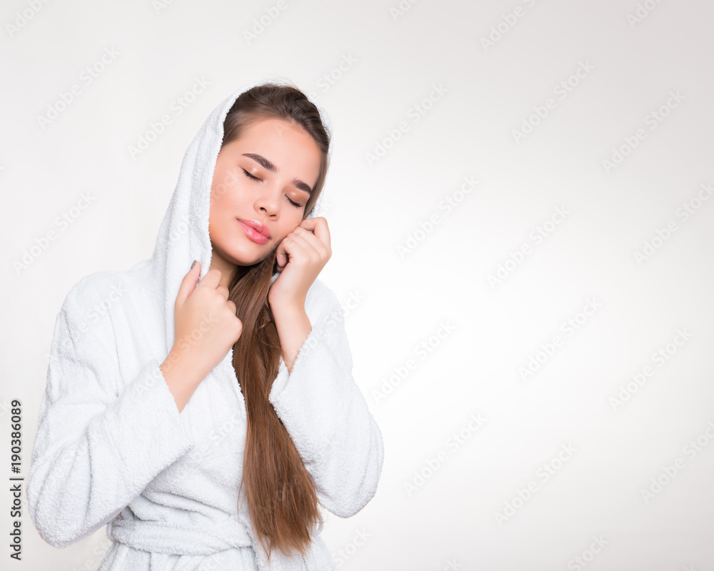 beautiful young woman with long hair wearing a bath robe beautiful young woman with long hair wearing a bath robe
