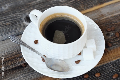 Delicious fresh Americano coffee on the wooden table