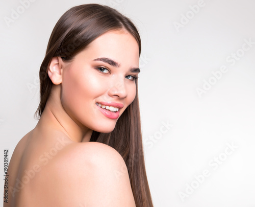beautiful young woman with long hair and flawless skin