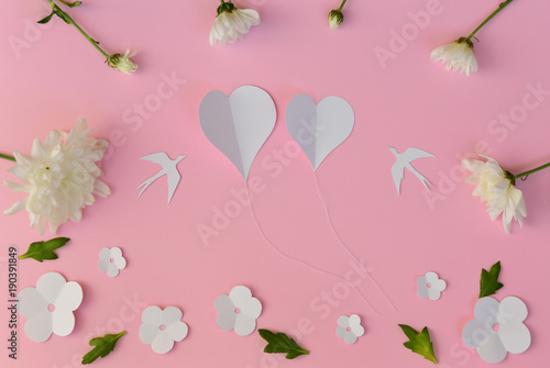 White flowers, hearts, birds on pink background
