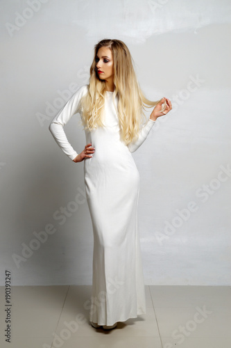 beautiful sexy girl posing in white dress