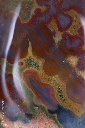 Polished multicolor ocean jasper from Madagascar background, texture  photo