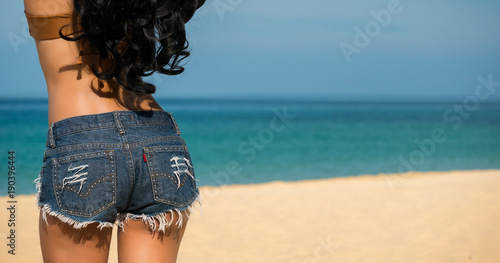 Wallpaper Mural Close up sexy woman ass with jeans on the beach on blur ocean background on sunny days and nice weather in travel and holiday concept with copy space. Torontodigital.ca