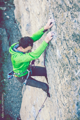 Fototapeta Naklejka Na Ścianę i Meble -  A rock climber on a rock.