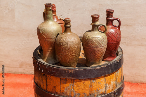 Wallpaper Mural Ancient vein standing on a barrel in bottles. Ancient wine. Torontodigital.ca