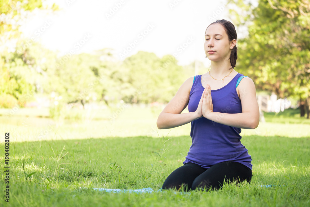 Beautiful woman doing yoga exercises in the park. Concept of healthy lifestyle. Beautiful woman doing yoga exercises in the park. Concept of healthy lifestyle.