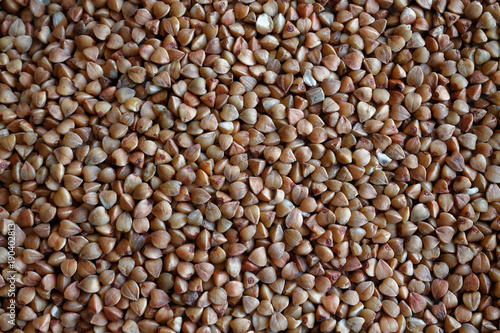 Buckwheat texture high-quality photograph of premium buckwheat groats The concept of proper nutrition and healthy lifestyle. Top view, close-up as background or texture