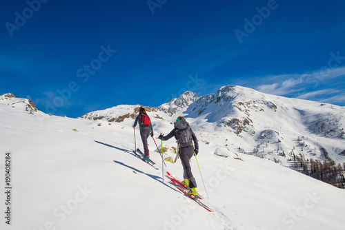 A couple of women practice ski mountaineering
