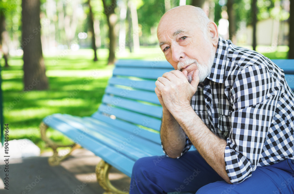 Pensive senior man outdoors Pensive senior man outdoors