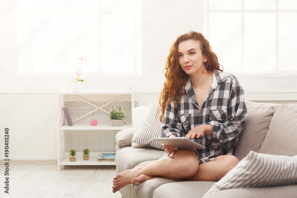 Thoughtful girl with digital tablet at home Thoughtful girl with digital tablet at home