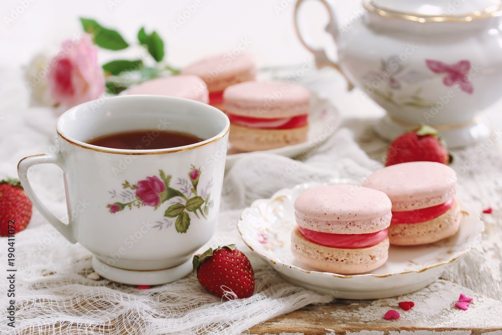 Homemade Pink Macaroons or Macarons with a cup of coffee Homemade Pink Macaroons or Macarons with a cup of coffee