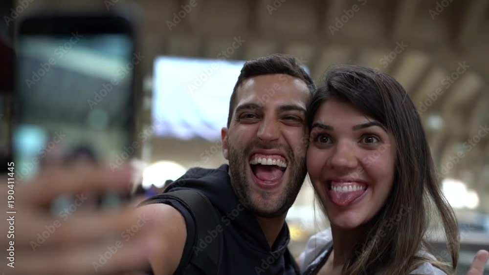 Young Couple Taking a Selfie with Mobile Young Couple Taking a Selfie with Mobile