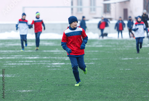 boys play football tournament at the winter stadium