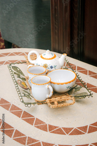 Beautiful ceramic tea set on a table photo