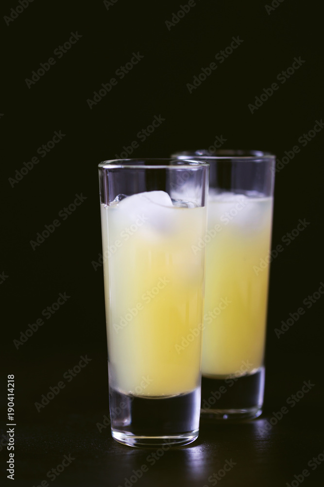 Italian lemon lime liqueur limoncello with ice and mint Italian lemon lime liqueur limoncello with ice and mint