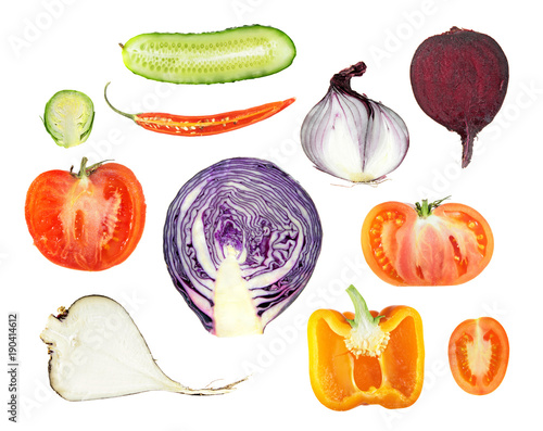 Set of different fresh vegetables cut in half inside longitudinal section and isolated on white background
