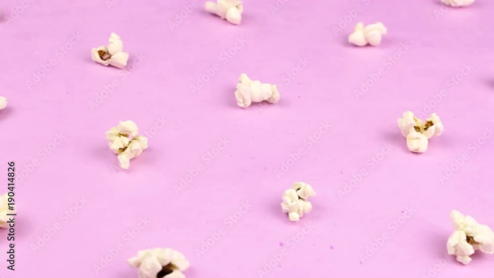 Popcorn close up macro on pastel ultraviolet texture surface. Popcorn close up macro on pastel ultraviolet texture surface.