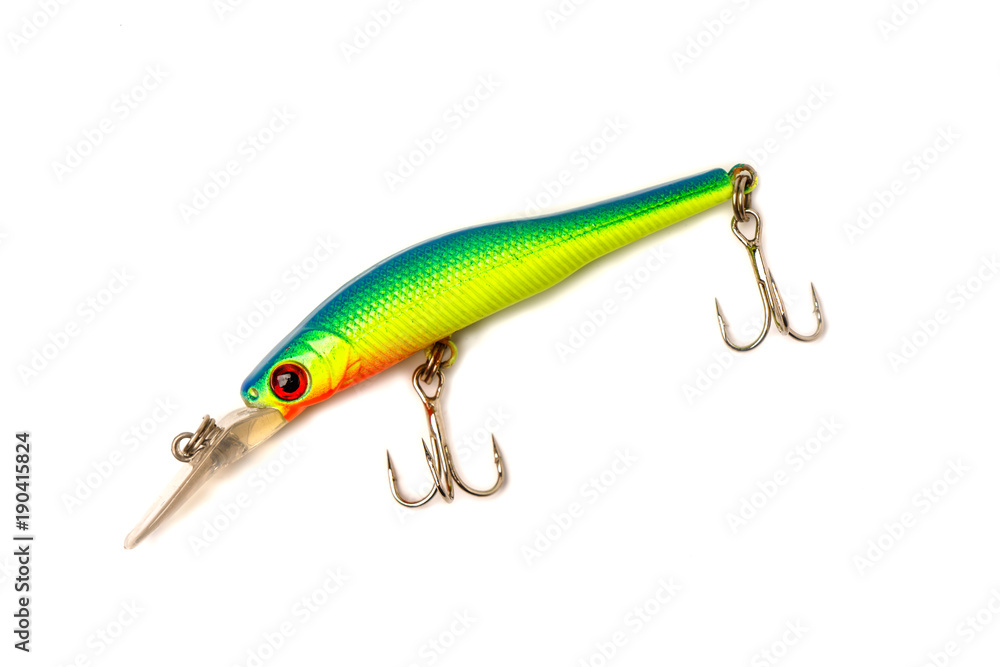 A bait for fishing on a tarpaulin background. Wobblers of differ A bait for fishing on a tarpaulin background. Wobblers of differ