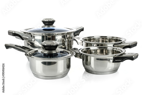 Group of premium stainless steel pots and pans isolated on a white background.