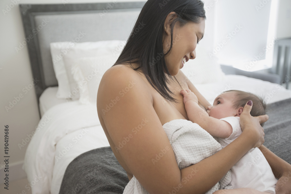 Woman breast-feeding baby son Woman breast-feeding baby son