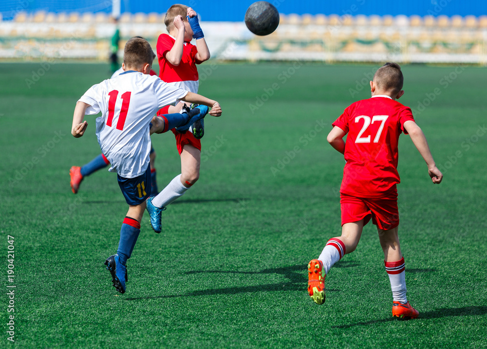 kids play football tournament and enjoy their game on the stadium kids play football tournament and enjoy their game on the stadium
