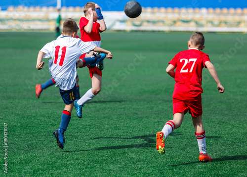 kids play football tournament and enjoy their game on the stadium