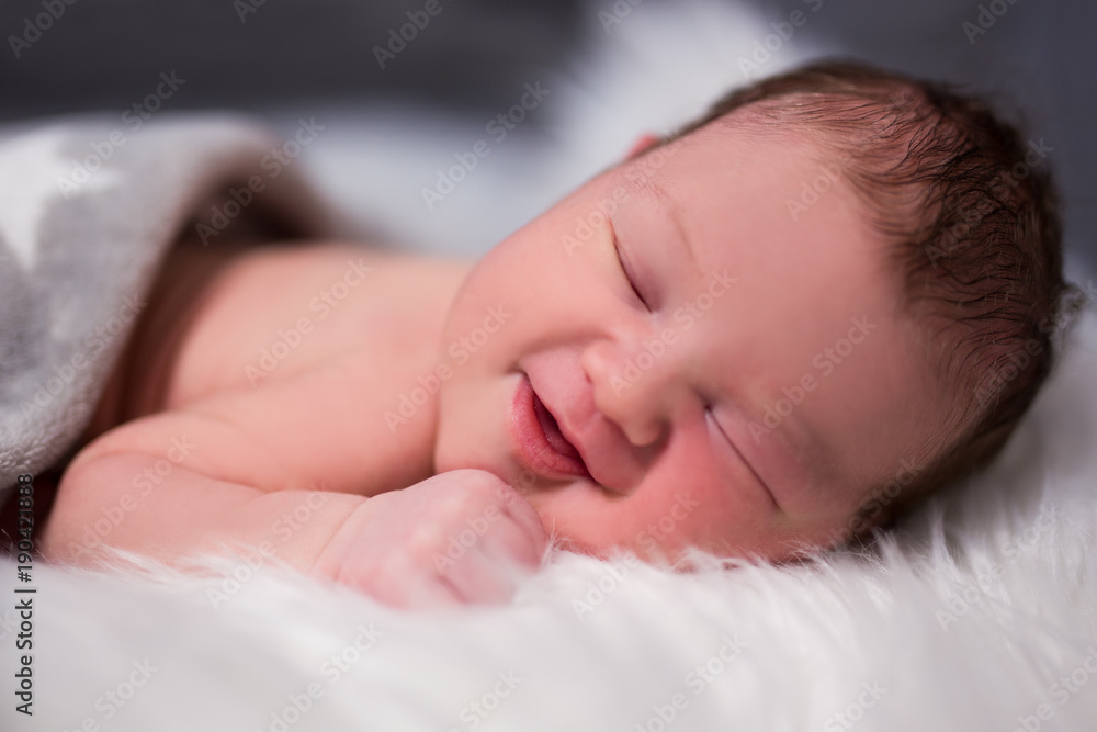 close up of beautiful smiling baby sleeping close up of beautiful smiling baby sleeping