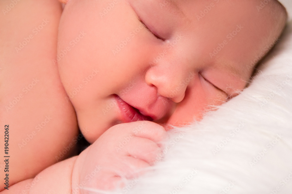 close up of cute sleeping newborn baby face close up of cute sleeping newborn baby face