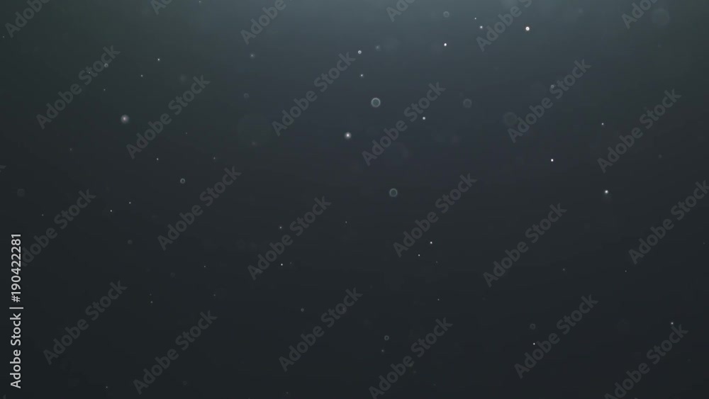 backlit dust particles with bubble like bokeh floating in slow motion