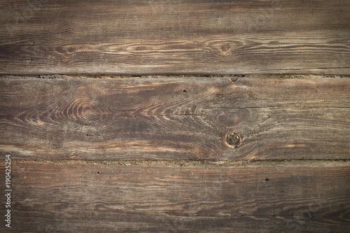 very old logs of the house wall, horizontal, tow, cracks, defects