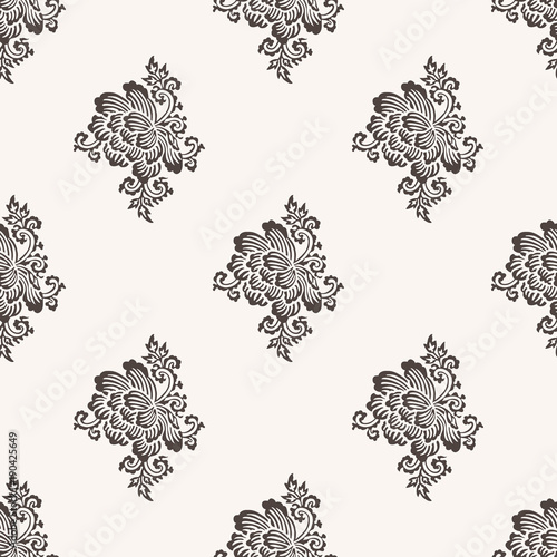 Seamless woodblock printed paisley pattern. Traditional oriental Indian ethnic ornament with peony flowers, taupe on beige background. Textile design.