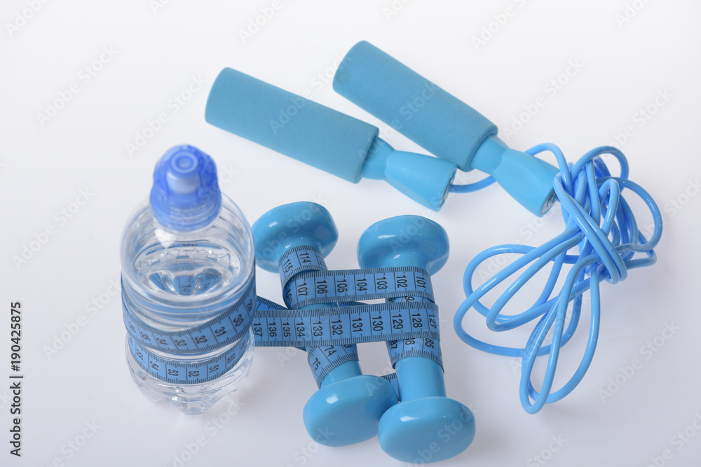 Naklejka premium Health and fitness symbols. Jump rope, water and barbells