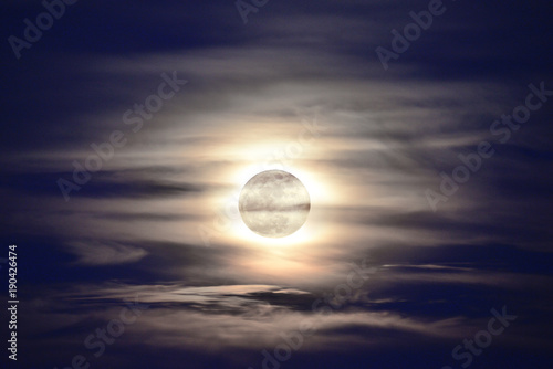 Full moon with cloudy sky.