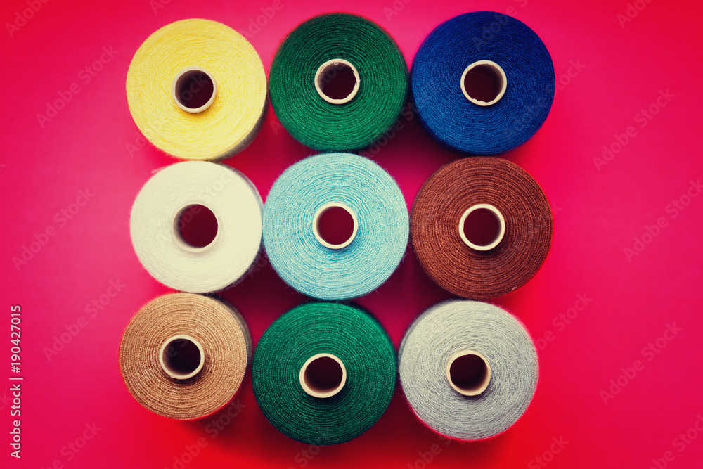Pile of colorful spools of thread Pile of colorful spools of thread