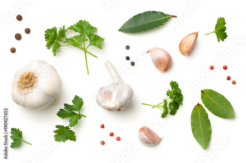 Garlic, Bay Leaves, Parsley, Allspice and Pepper Isolated on White Background photo