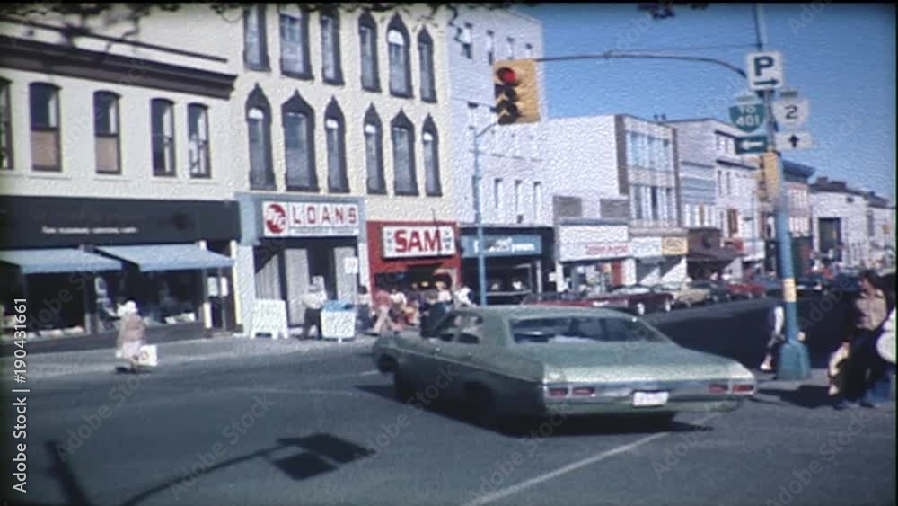 City bus makes left turns at intersection in downtown of a small city. City bus makes left turns at intersection in downtown of a small city.