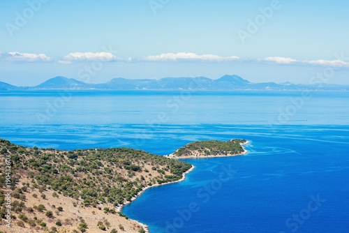 landscape of the Greek island of Kefalonia against the blue sky.