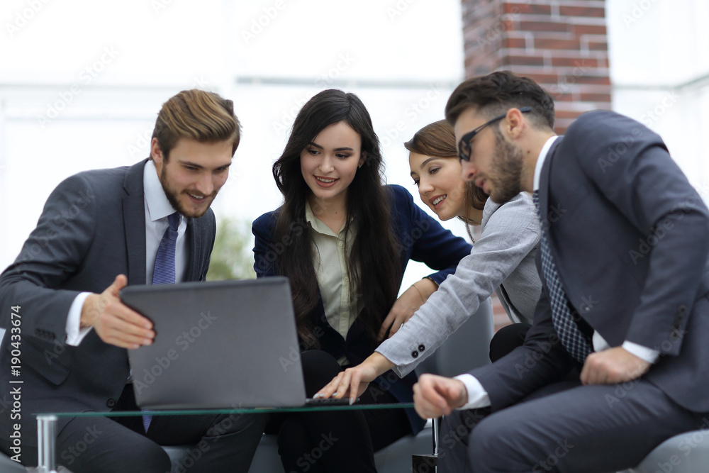 Beautiful business people are using a laptop during the conferen Beautiful business people are using a laptop during the conferen